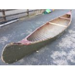 A 16ft handbuilt Canadian canoe, formerly kept on the Thames, the ribbed craft circa 1920