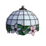 A Tiffany style leaded glass bowl shaped lighshade, the marbled white panels with floral leaf