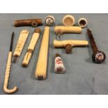 A small collection of antique ivory cane and parasol handles - carved, novelty with puzzles under