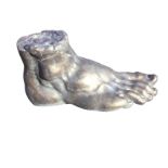 A giant bronzed archeological style classical composition stone foot. (19in x 10.75in)