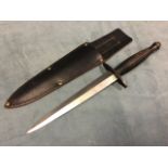 A World War commando knife by J Rowill & Sons with tapering steel blade and ribbed handle having nut