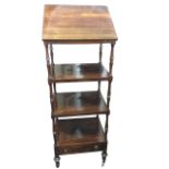 A nineteenth century rosewood whatnot, the top hinged shelf with ratchet support above three