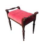 A rectangular Victorian mahogany piano stool with cushion velvet seat flanked by turned handles in