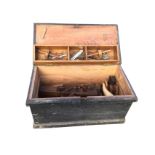 A pine toolbox with tools, the box with brass hinges having interior tray, the tools including