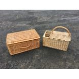 A large cane picnic hamper with hinged lid; and a cane picnic basket with bottle compartments and