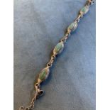 An aventurine station bracelet, the four oval stones in a bezel settings joined by links, the
