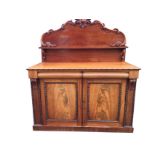 A George IV mahogany chiffonier with scroll carved back and rectangular shelf on scrolled