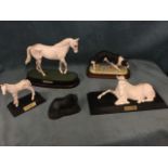 A Royal Doulton porcelain model of Desert Orchid, the stallion mounted on moulded wood plinth; a