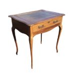 An Edwardian Stones Patent mahogany desk, the sliding top with gilt tooled leather skiver