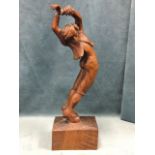 A C20th carved hardwood figure of a flamenco dancer, formed from a single piece of wood with deep