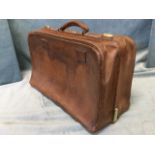 A gentlemans leather travelling case, having fitted interior and brass mounts. (22in x 13in)