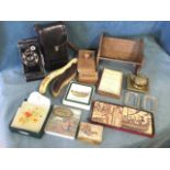 Miscellaneous items including a Kodak concertina camera, a brass inkwell, clothes brushes, a table