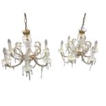 A pair of Italian style hanging glass chandeliers, each suspended from cup shaped fluted brass