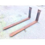 A pair of heavy forklift extension blades. (50in) (2)