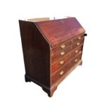 A George III mahogany bureau, the fallfront with feathered banding revealing a fitted interior