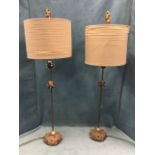 A pair of contemporary painted metal tablelamps with gilded mounted finials having similar