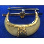 An 18ct gold bar brooch set with single pearl; another bar brooch claw set with shield shaped yellow