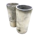 A pair of tubular stoneware chimney pots. (24.75in) (2)