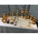 Miscellaneous brass including fourteen tankards - several in pairs, a large Victorian candlestick,