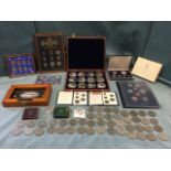 A collection of coins including cased & framed proof sets, loose crowns, collectors sets, etc. (A