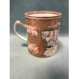 A large nineteenth century Chinese famile rose tankard decorated with figural garden landscape scene