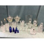 Miscellaneous glass including a pair of fluted urns & covers, a suite of cut vases, decanters &