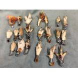 A collection of 19 Scottish grouse foot brooches, mostly mounted with coloured stones, having hinged