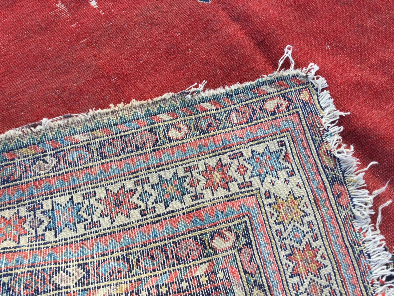 A Bokhara rug woven with central diamond shaped medallion on an orange field framed by ink blue - Image 3 of 3