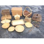 Two antique cane fishing creels; a rectangular cane hamper; and various cane baskets, trays, Fortnum