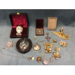 Miscellaneous items including a cased egg cup, brooches, gilt metal bows, photo frames, an Essex