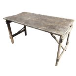 A George VI oak trestle table with two plank rectangular top on folding legs - stamped mark. (53.