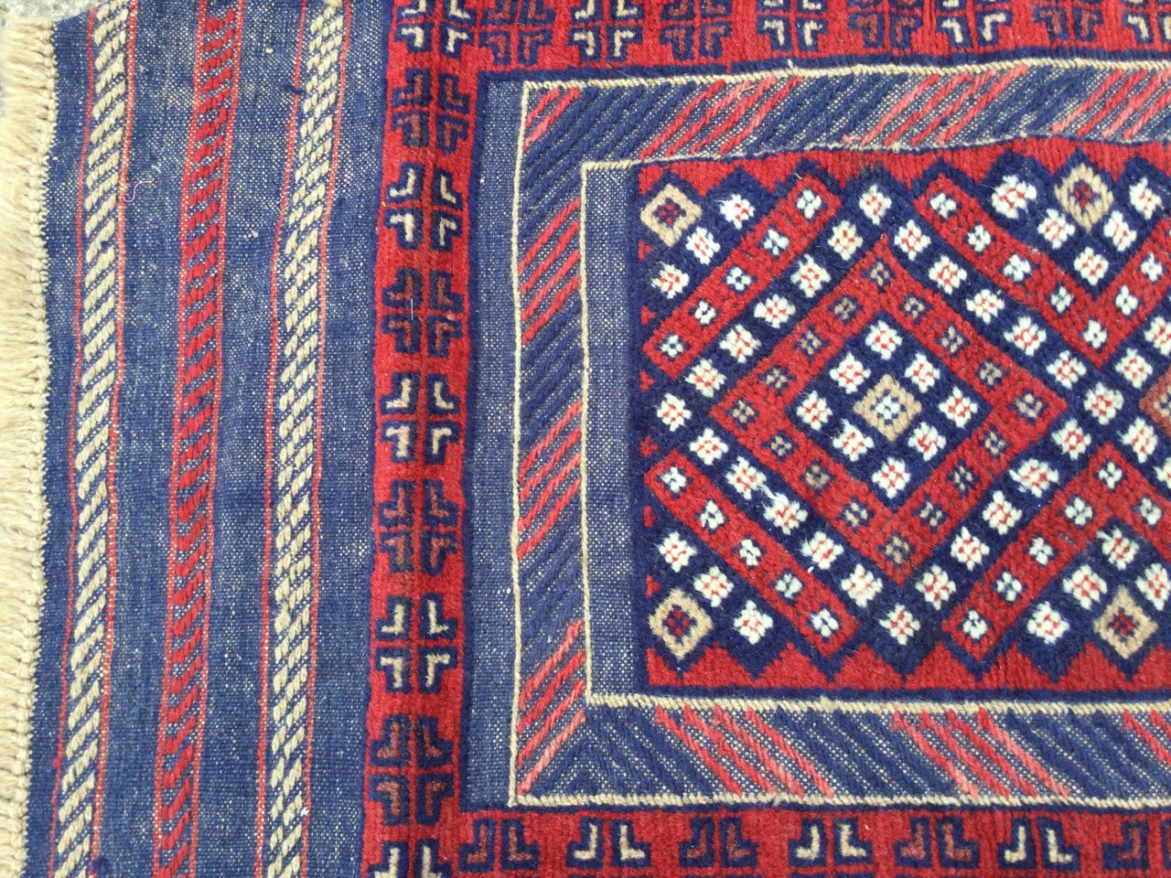 A rectangular Bokhara runner woven with diamond panel framed by chevron band, the outer border - Image 2 of 3