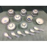 A collection of Chinese blue & white rice & tea bowls, spoons & covers, decorated in the traditional