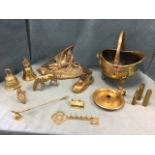 Miscellaneous brass including a large French battle inkwell, a coal scuttle, bells, shell cases, a