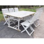 A painted teak extending garden table with slatted top on rectangular legs with shaped batton