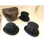 A leather hatbox containing a Christys silk top hat; a Locke & Co bowler riding hat; and two other