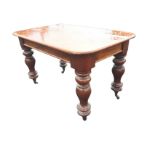 A Victorian mahogany table with later alterations, the rectangular rounded top on bulbous turned
