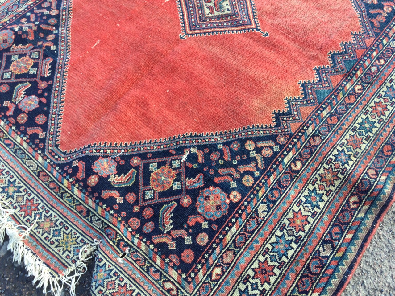 A Bokhara rug woven with central diamond shaped medallion on an orange field framed by ink blue - Image 2 of 3