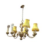 A hanging gilt ormolu chandelier with caryatid style column supported by chain from ceiling rose,