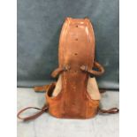 A 1950s leather & canvas spinal back support, as worn by jet pilots for ejector seat protection,