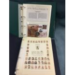 A folder containing a limited edition of Henry VIII and his six wives medallions; and an album of