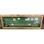 A cased set of angling ephemera on baize ground including a greenheart rod, floats, flies, prints, a