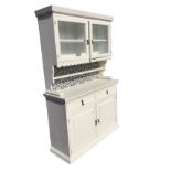 A painted kitchen dresser, the top with moulded cornice above a glazed door cupboard with