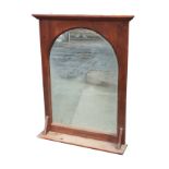 A pine framed mirror with moulded cornice above an arched plate having acid etched leaf