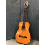 A Hohner classical nylon strung guitar with transfer printed decoration framing soundhole, having