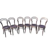 A set of six European bentwood dining chairs, with hooped backs above circular seats with pressed