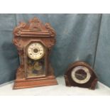 An American gingerbread type clock in carved architectural style case with angled fishscale