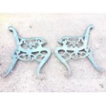 A pair of cast iron bench ends with lion mask terminal to arms, the frames with scrolled