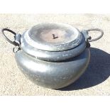 A cauldron type brass patinated pot & cover having ring handles with acanthus leaf mounts, the