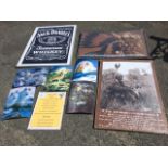 A framed Jack Daniels poster; five 3D hologram type pictures of wolves; two prints of Native